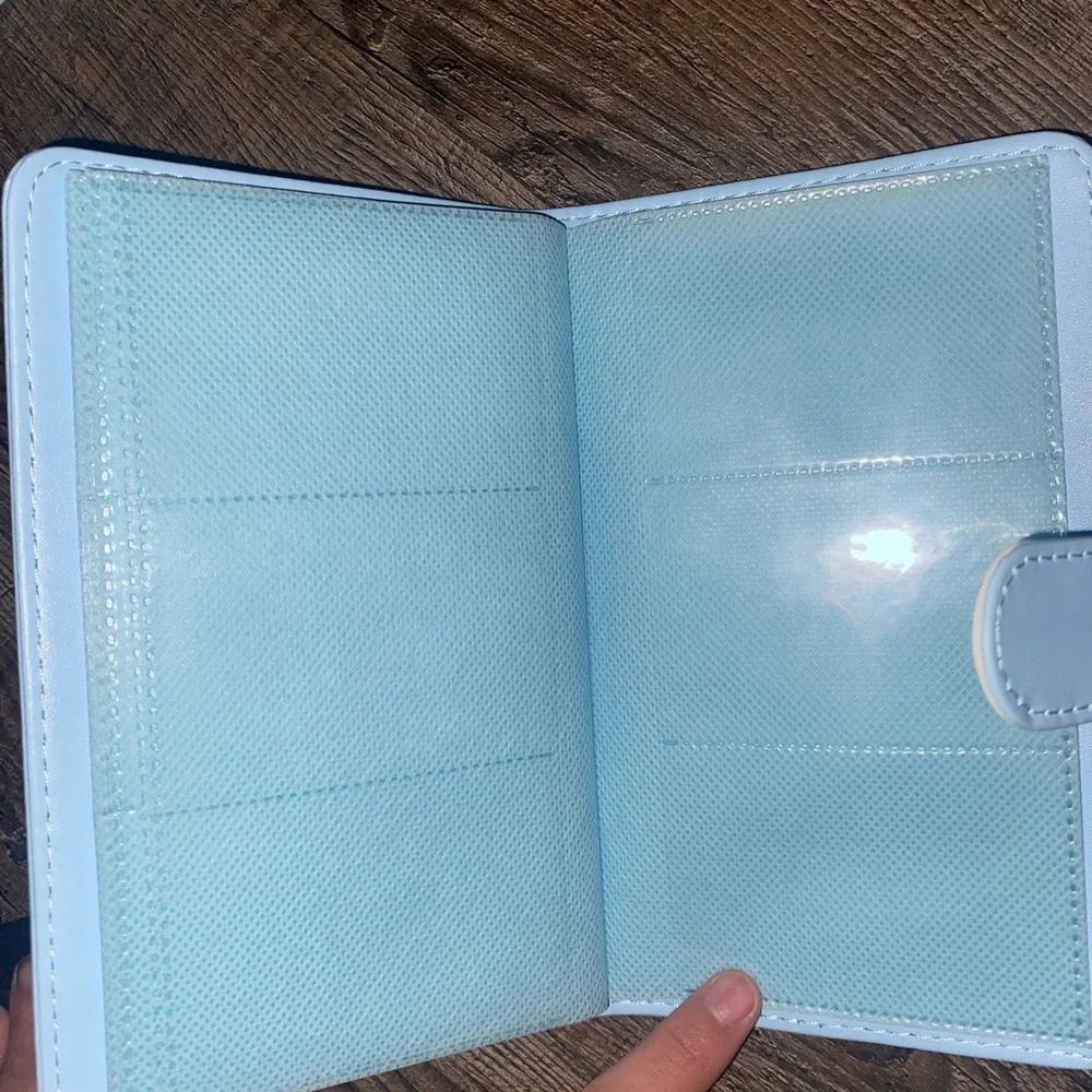 Baby Blue Polaroid Camera with photo book, film, and etc.